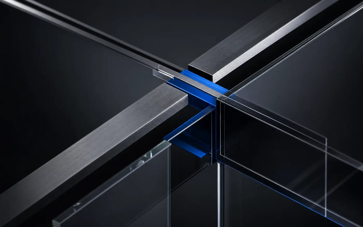 Graphite, glass, and cobalt structural beams meeting at a precise connection